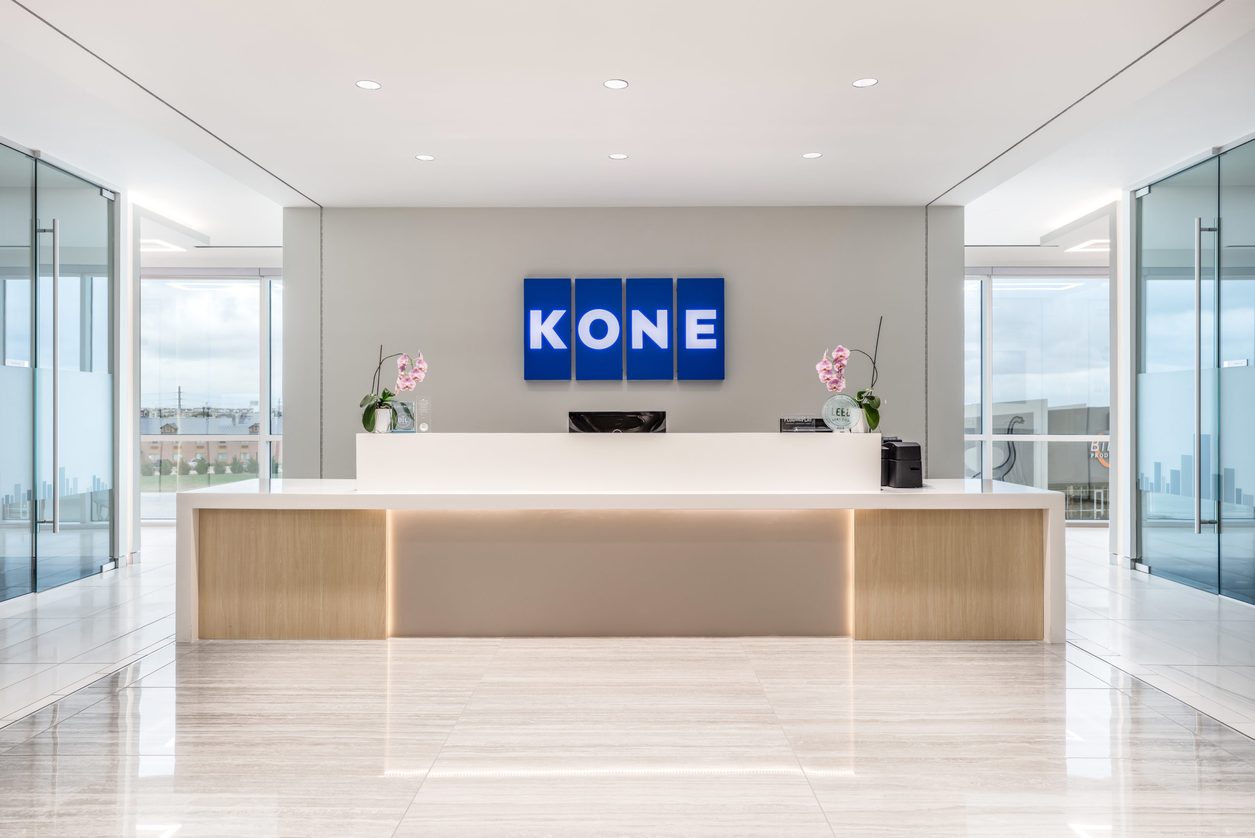 Straight-on view of the KONE entry area in Allen, TX, showcasing the sleek, modern design characteristic of the elevator company's architectural style.